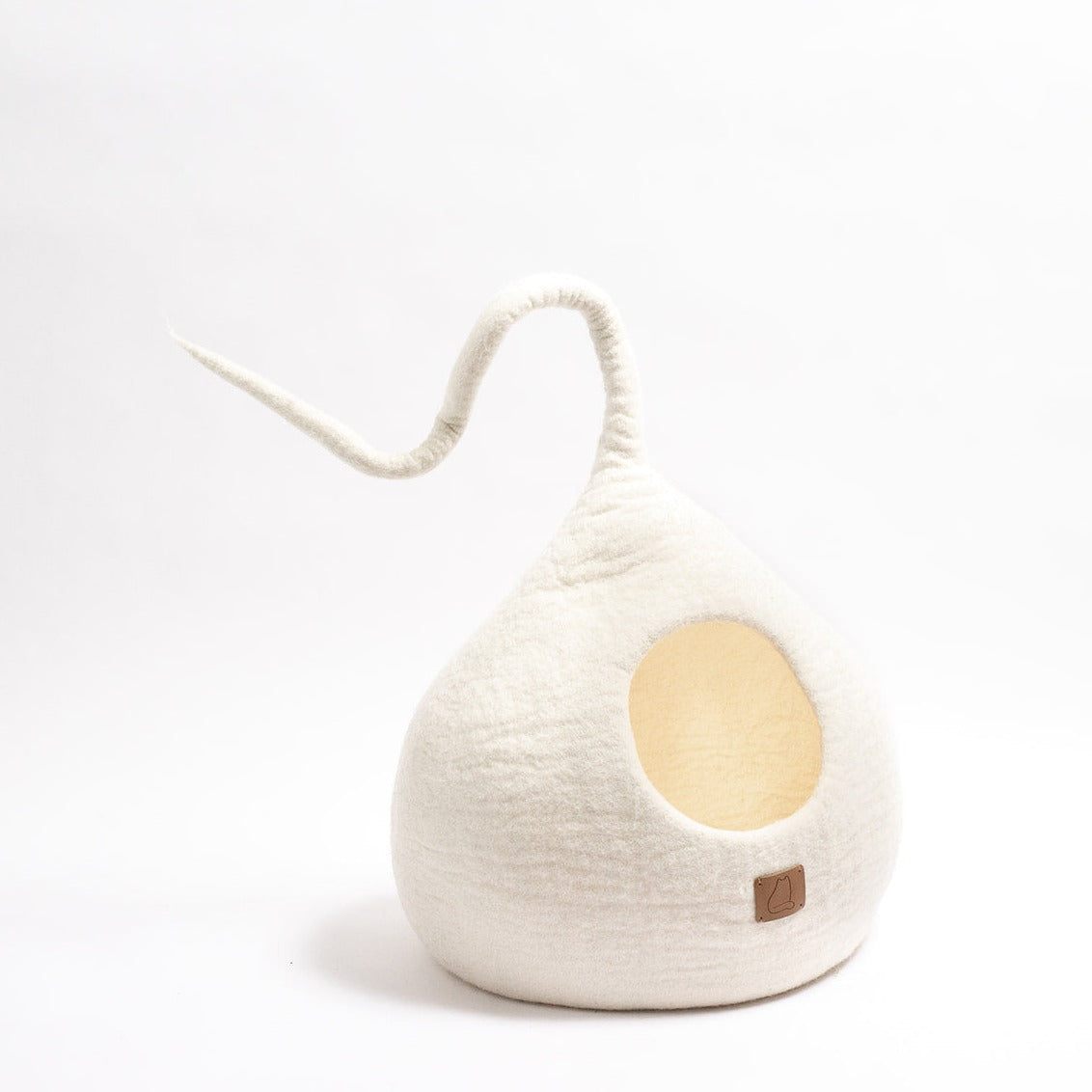 Snow White Tail Style Cave for cats, handcrafted from felted wool, featuring a peekaboo entrance and modern design, perfect for home decor.