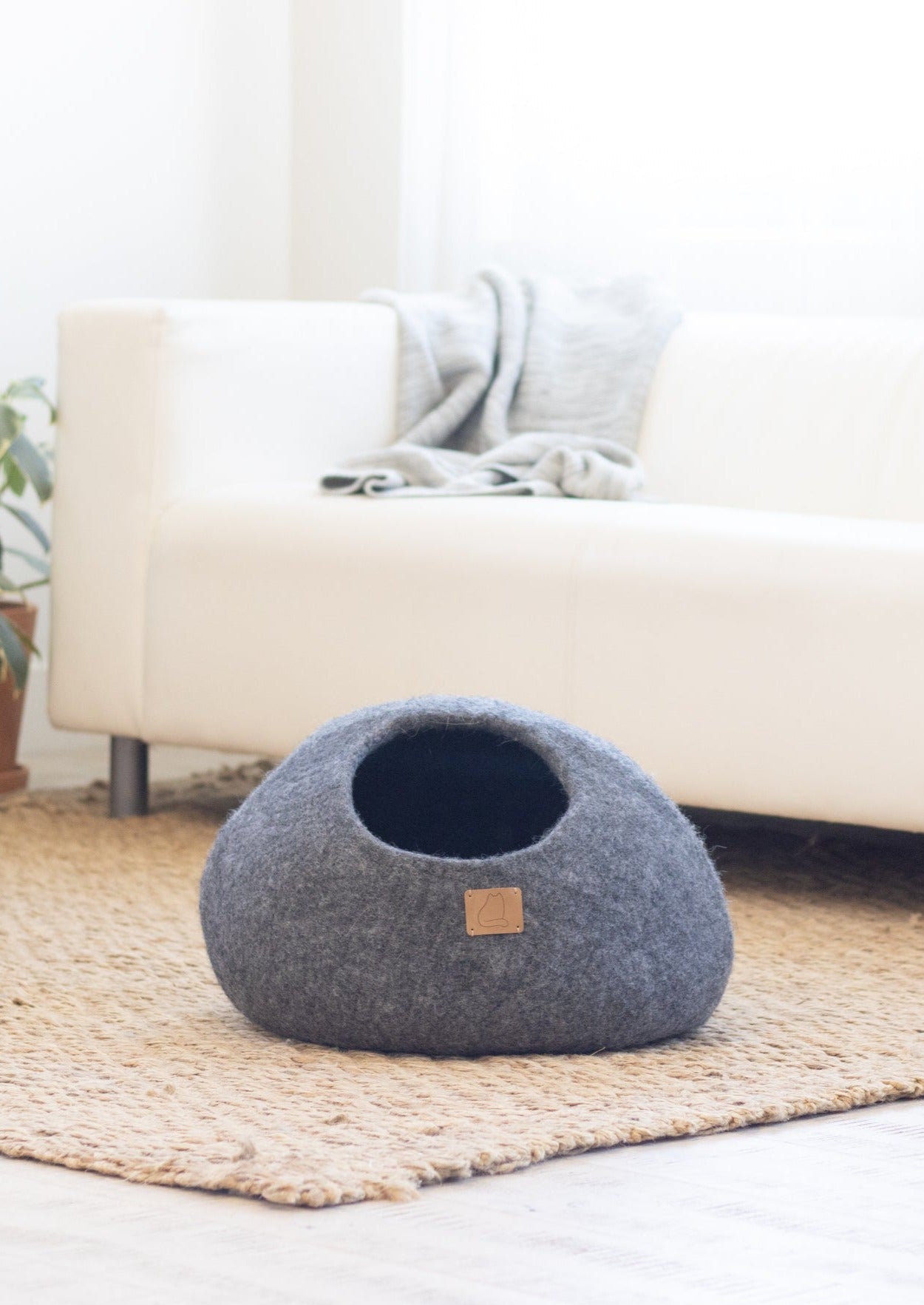 Stone Gray Round Style Cave, a cozy felted wool cat bed with a peekaboo design, perfect for cats of all sizes.