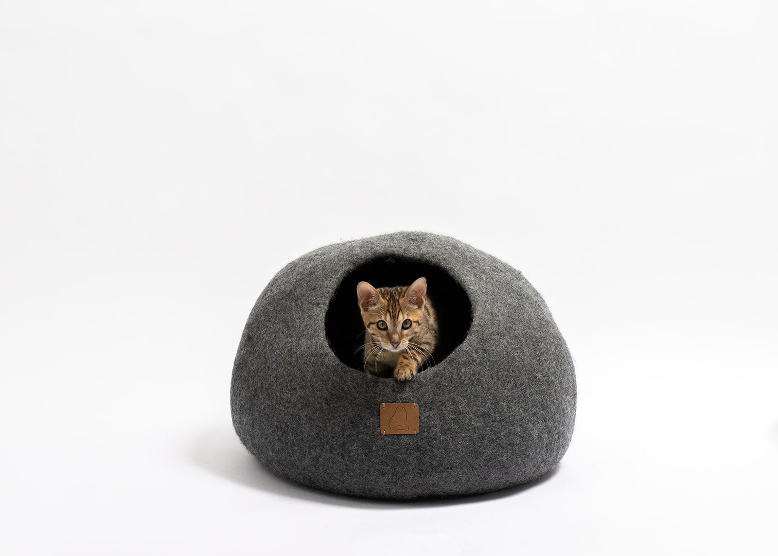 Stone Gray Round Style Cave, a cozy felted wool cat bed with a peekaboo design, perfect for cats of all sizes.