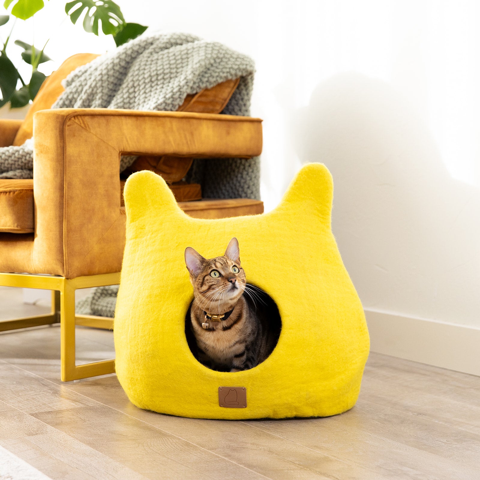 Sunny Yellow Ear Style Cave made of luxury felted wool, featuring a cozy design and peekaboo entrance, perfect for cats of all sizes.