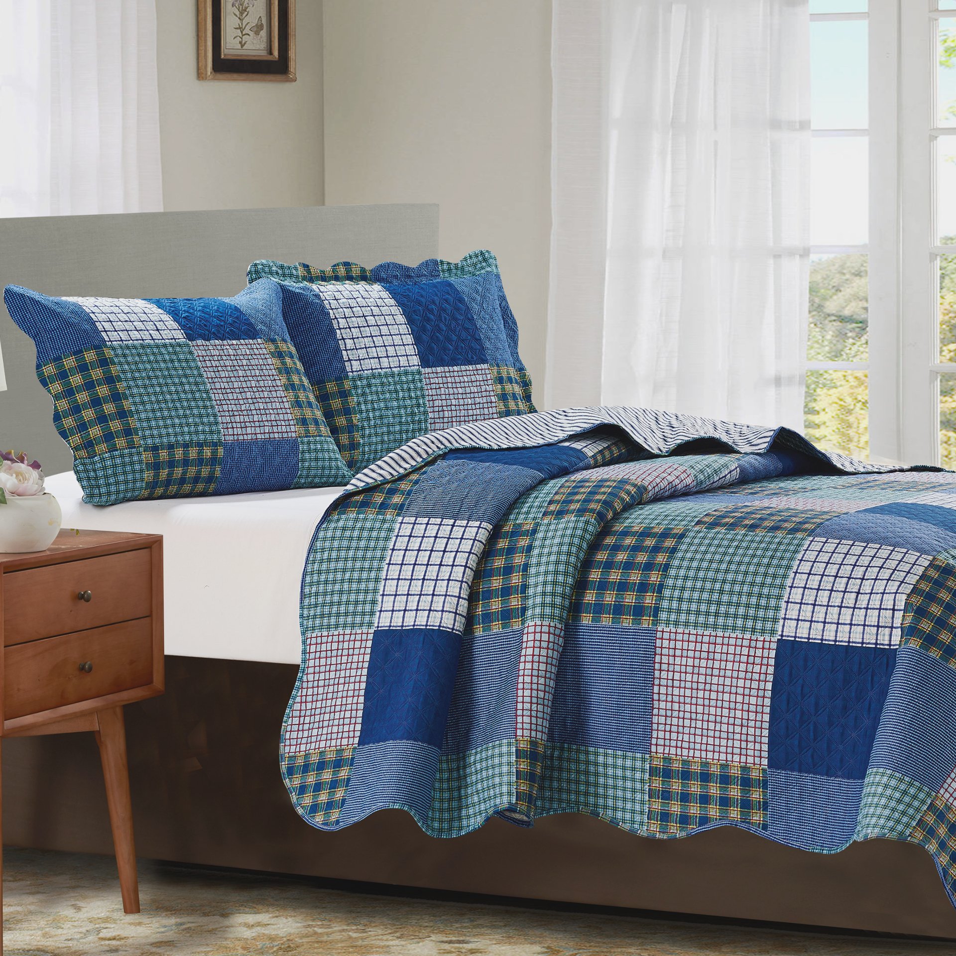 Suzy 3 Piece Quilt Set in Blue featuring a quilt and two matching pillow shams, showcasing a stylish design suitable for various bedroom styles.