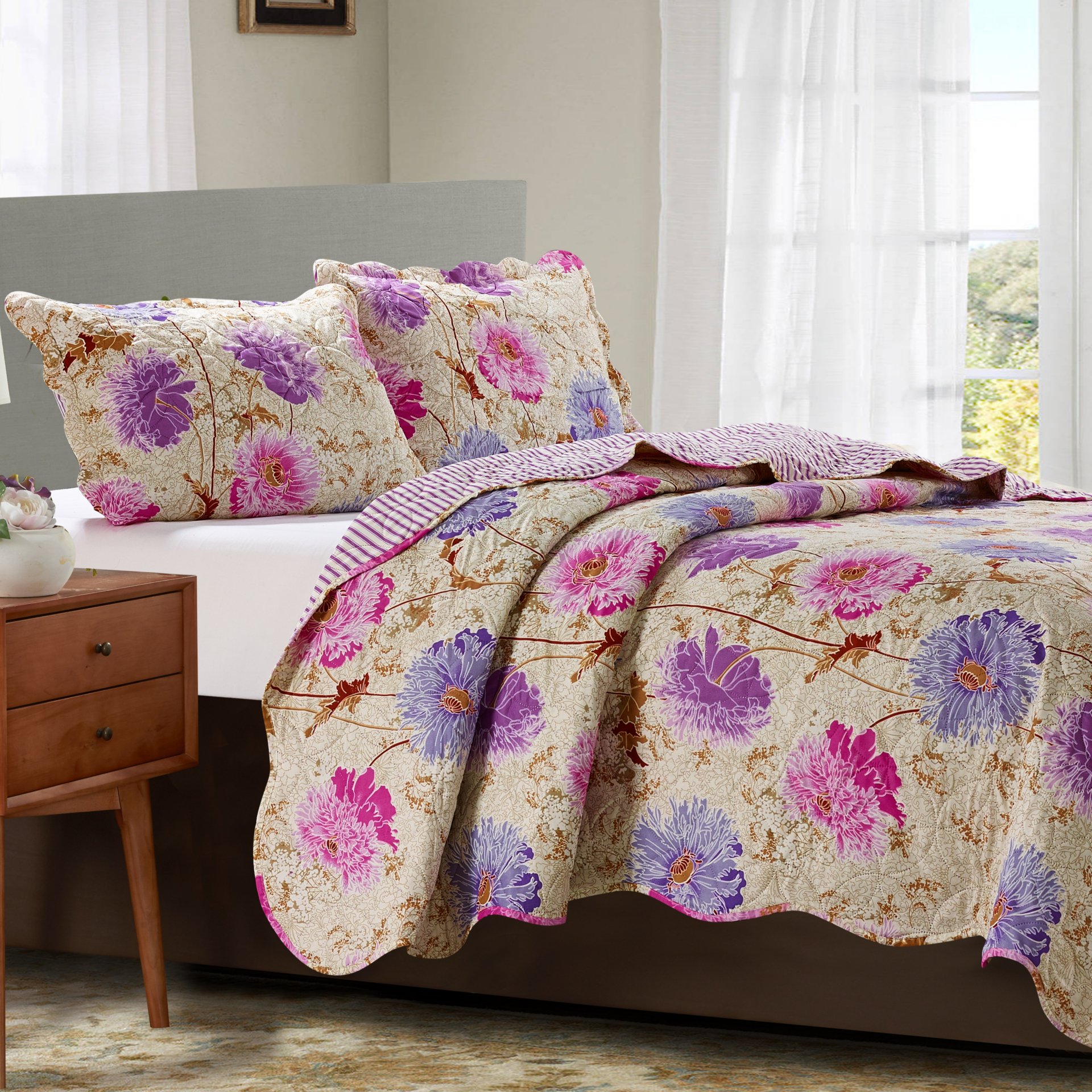 Suzy 3 Piece Quilt Set in Purple, featuring a quilt and two matching pillow shams, elegantly displayed on a bed.