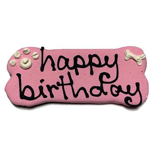 A pack of Birthday Bones dog treats, shaped like bones and topped with yogurt coating, featuring a peanut butter flavor, perfect for celebrating pet birthdays.