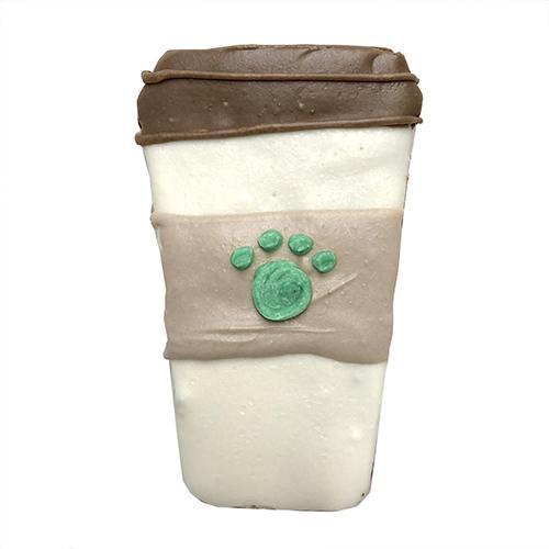 A pack of Coffee Dog Treats featuring peanut butter flavor, shaped like coffee cups, topped with yogurt coating and vegetable coloring.