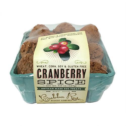 A charming 4x4 crate box filled with cranberry treats for dogs, showcasing wholesome ingredients like oat flour, cranberries, and spices.