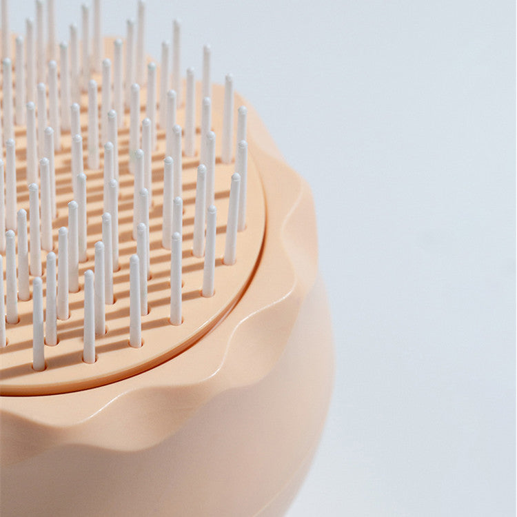 Floating Massage Pet Needle Comb designed for cat grooming, featuring soft silicone bristles for comfort and effective hair removal.