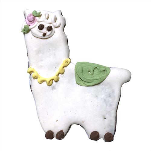 A box of adorable llama-shaped cookies made with peanut butter, featuring a yogurt coating and colorful vegetable coloring.