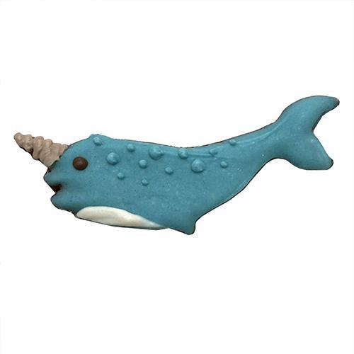 A whimsical narwhal-shaped dog treat made from peanut butter, oat flour, and honey, topped with yogurt coating.