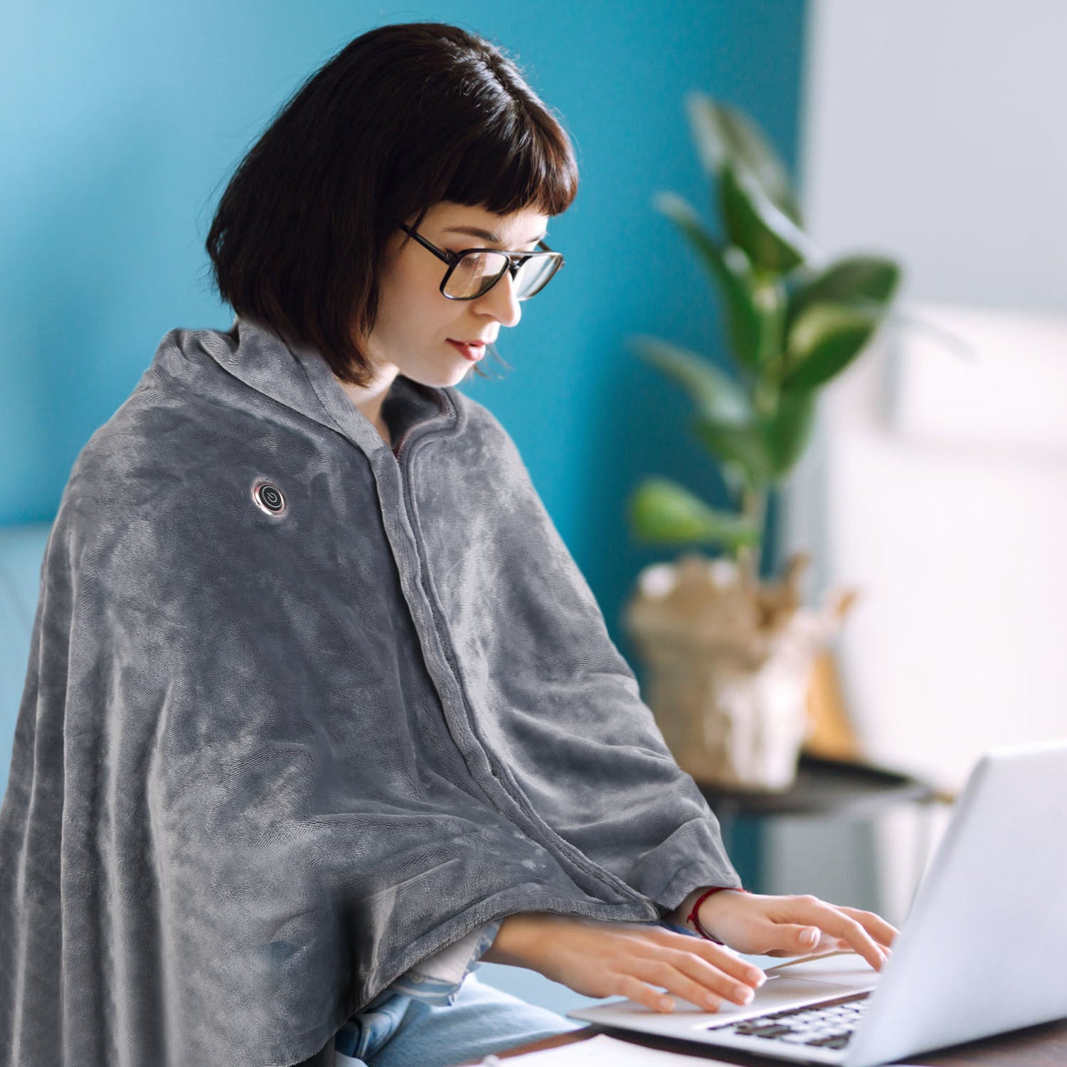 A cozy 59 Plus 31in USB Heated Blanket in grey, featuring a zipper design for arm mobility and soft flannel material for comfort.