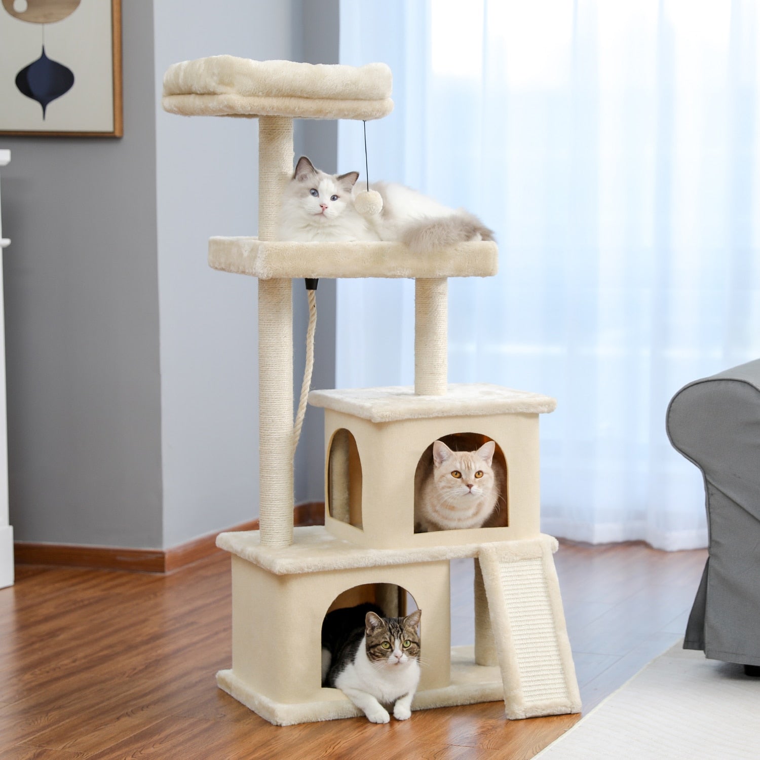 A multi-level Cat Tree Entertainment Tower with stairs, featuring cozy houses, scratching posts, a swinging ball, and sisal rope, designed for playful cats.