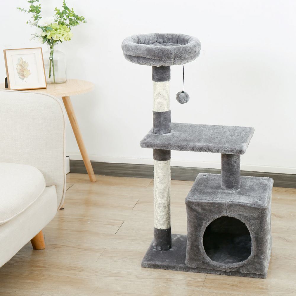 A multi-tiered cat tree house featuring scratching posts and resting areas, designed for playful cats.