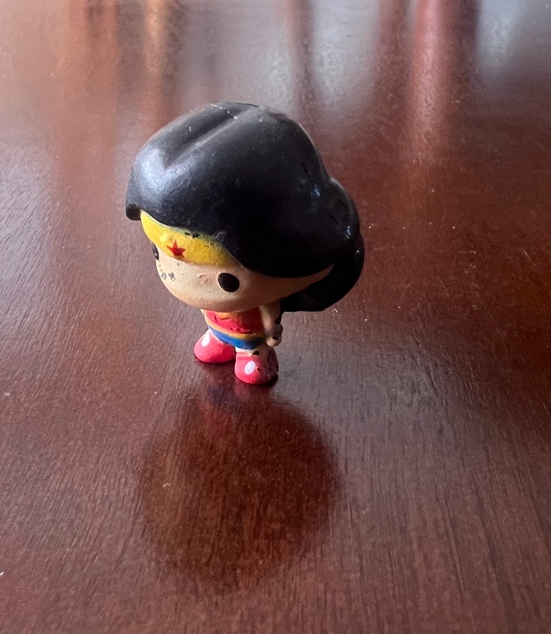 DC Comics Chibi Wonder Woman minifigure bobblehead, 1.5 inches tall, featuring vibrant colors and a cute design.