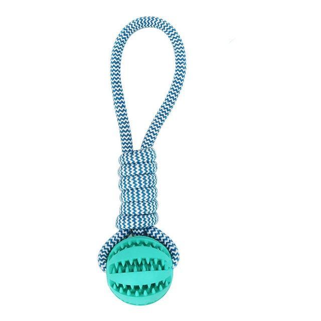 Durable rubber ball chew toy with cotton rope, designed for dogs, featuring a soft texture and vibrant colors for safe chewing and interactive play.