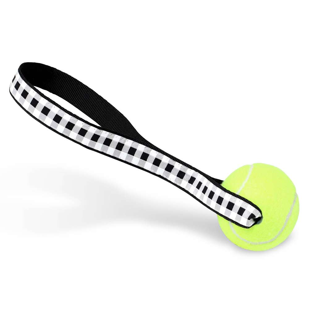 Farmhouse Check Tennis Ball Toss Toy featuring a durable nylon loop handle and a non-pressurized Tuff Ball, designed for safe and fun playtime.