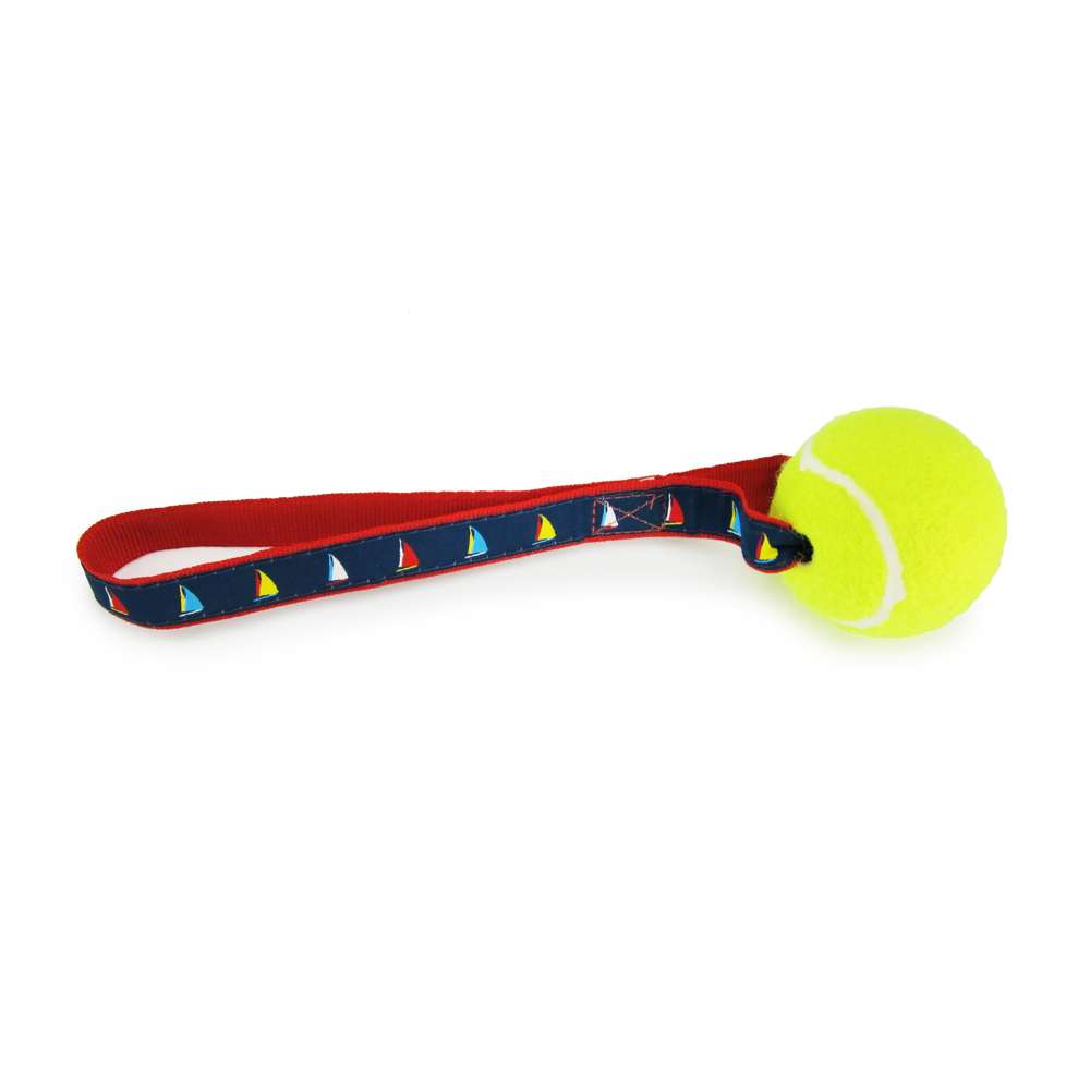 A colorful Sailboat Tennis Ball Toss Toy featuring a nylon loop handle and a durable Tuff Ball, designed for safe and fun playtime with dogs.