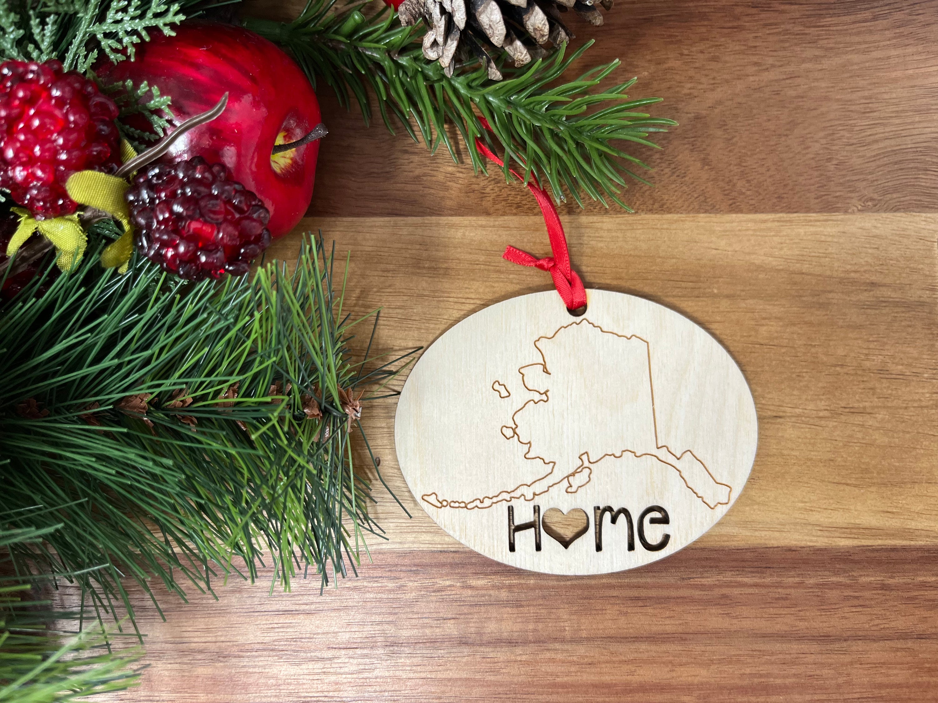 Alaska State Wood Christmas Ornament featuring 'Home' design, made from premium Baltic Birch wood.