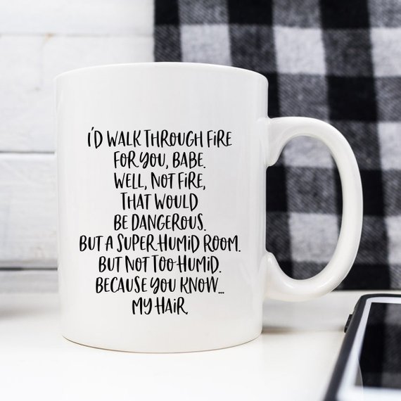 White mug with humorous text.