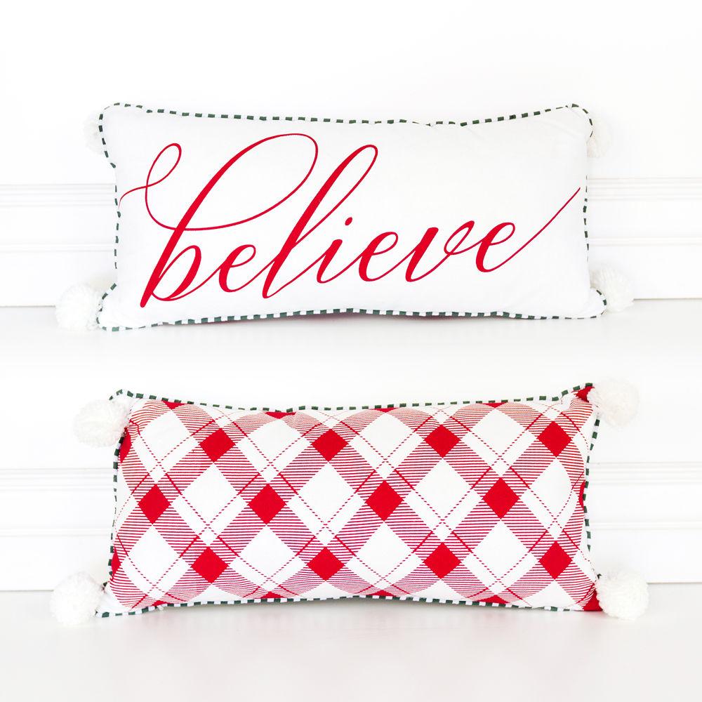 Believe pillow from Gia Roma's Premium Holiday Collection featuring red script and plaid design, adorned with tassel balls.