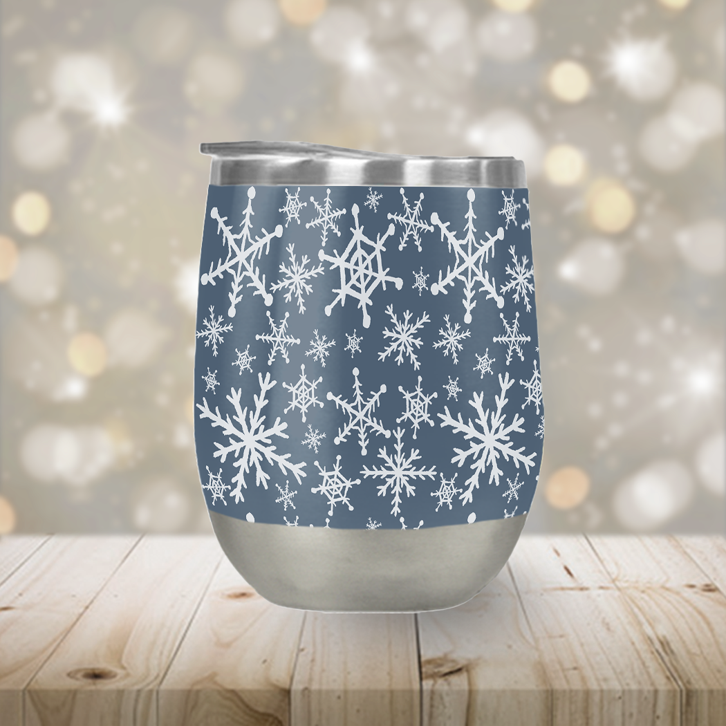 Blue Snowflakes Stemless Wine Tumbler with double-wall vacuum insulation, featuring a stylish snowflake design, perfect for outdoor use.