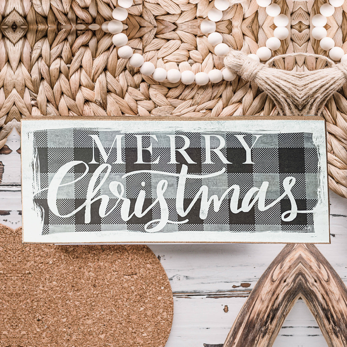 A handmade Buffalo Check Sign made of thick wood, featuring a classic black and white checkered pattern, perfect for holiday decor.