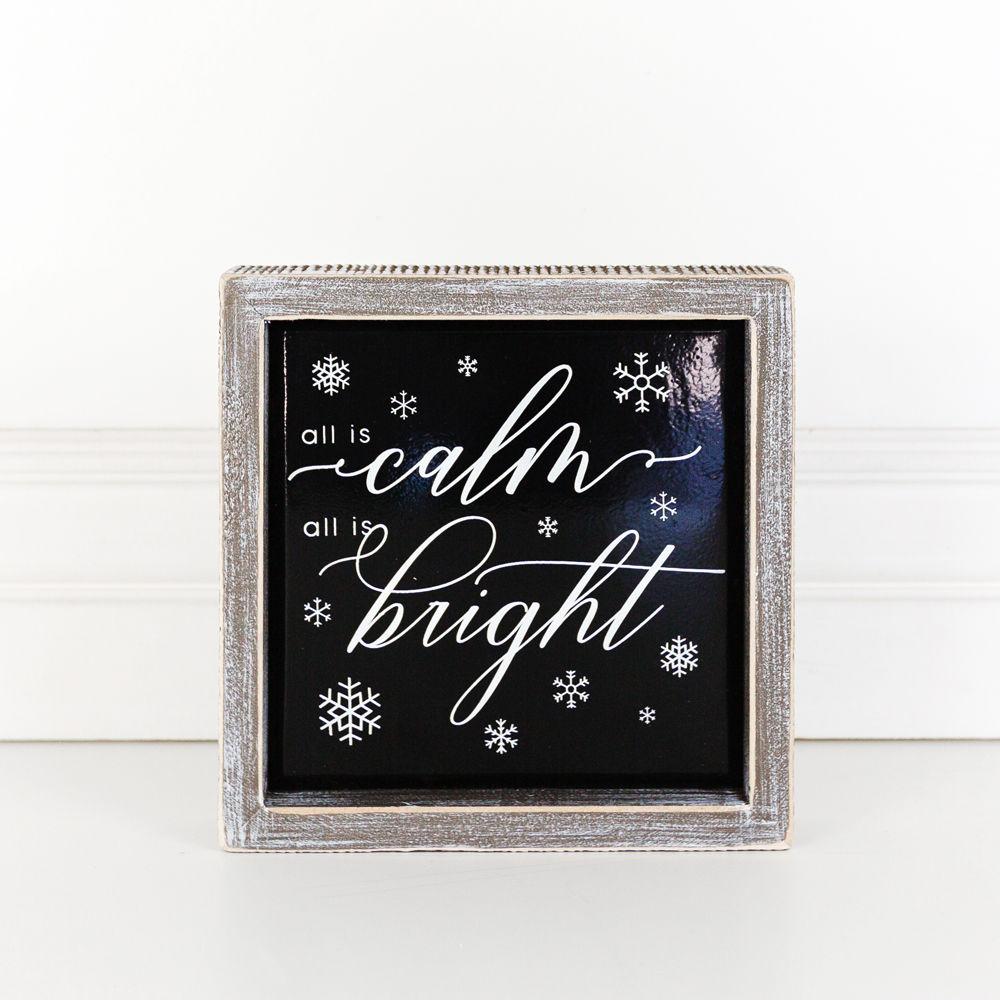 A stylish 7-inch wooden framed sign with embossed lettering that reads 'All is calm all is bright', perfect for holiday decor.