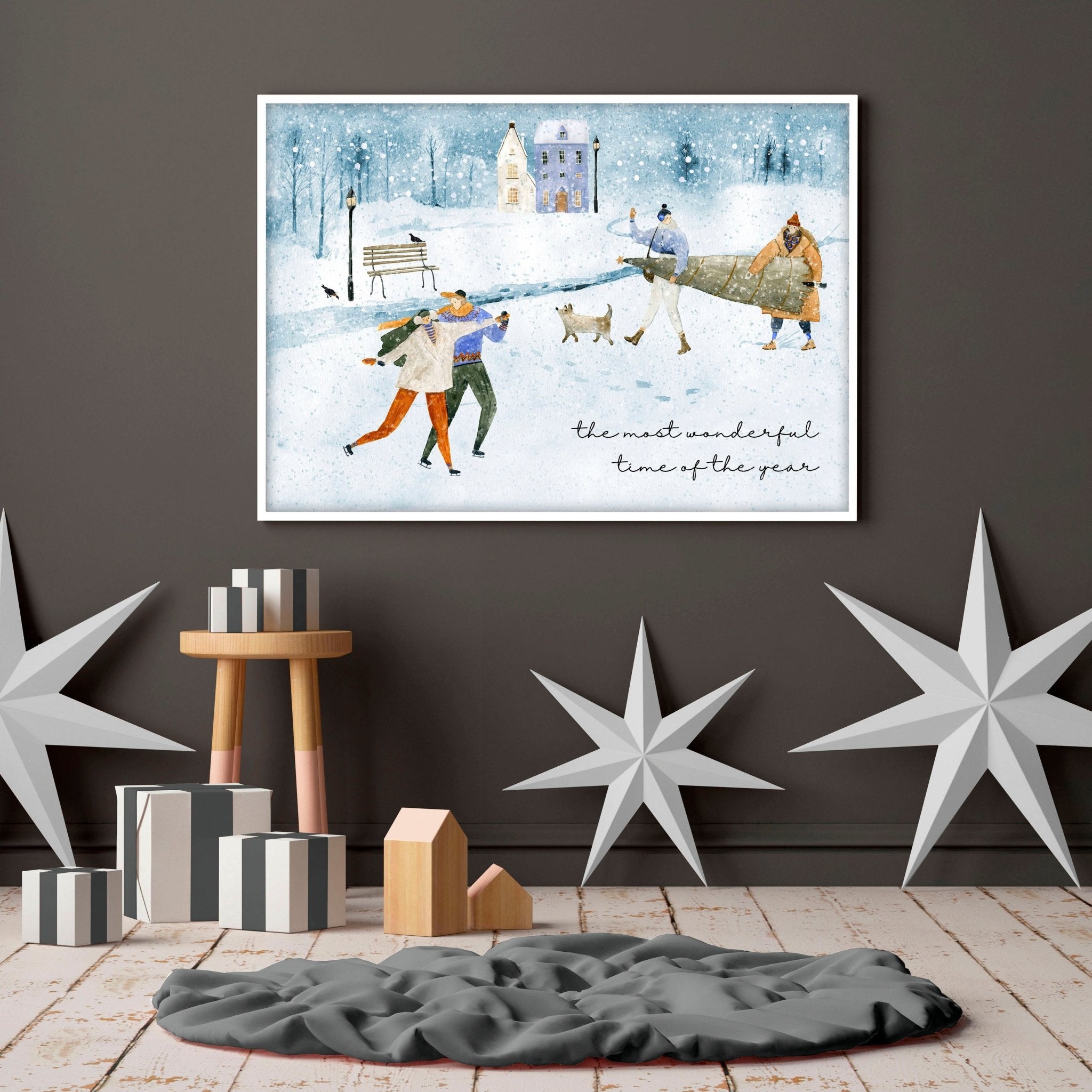 A beautiful Christmas decor wall art print featuring a snowy village scene with joyful skaters and a Christmas tree in soothing bluish tones.