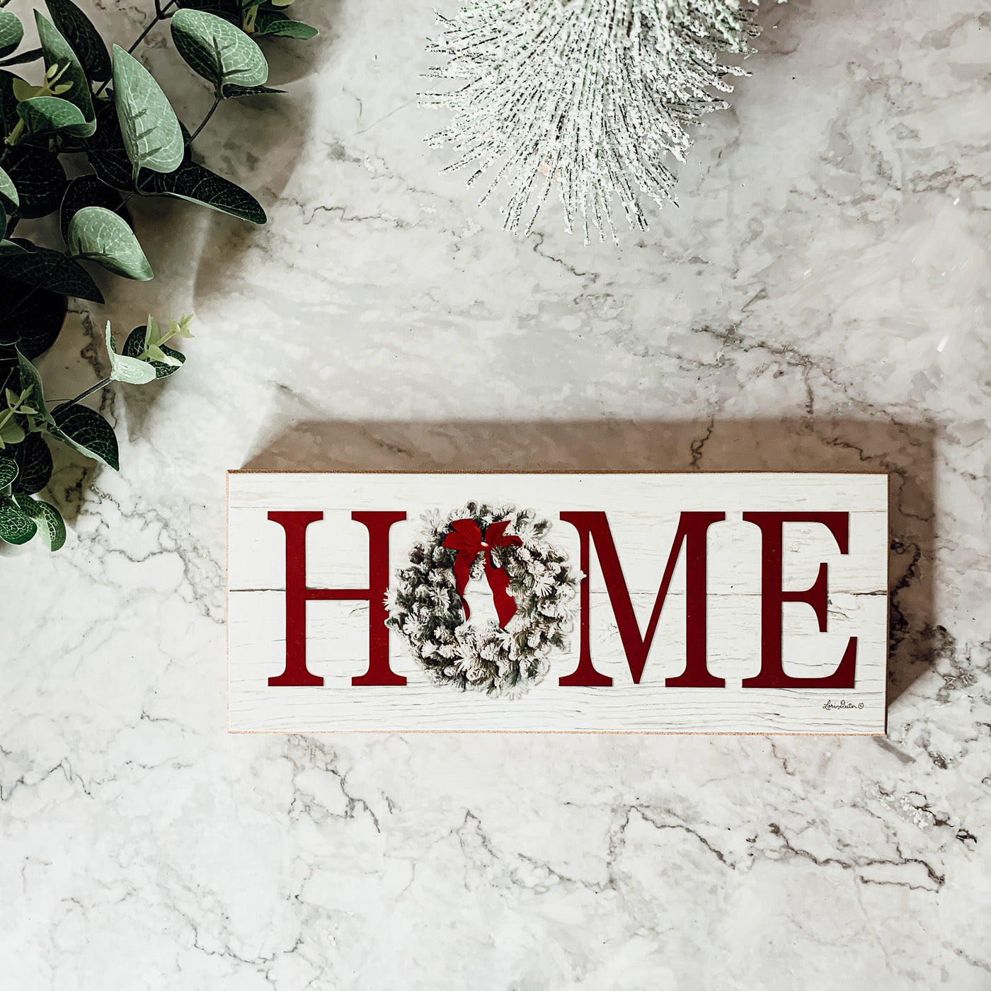 Handmade wooden Christmas Home sign with a festive wreath on the letter 'O', perfect for holiday decor.