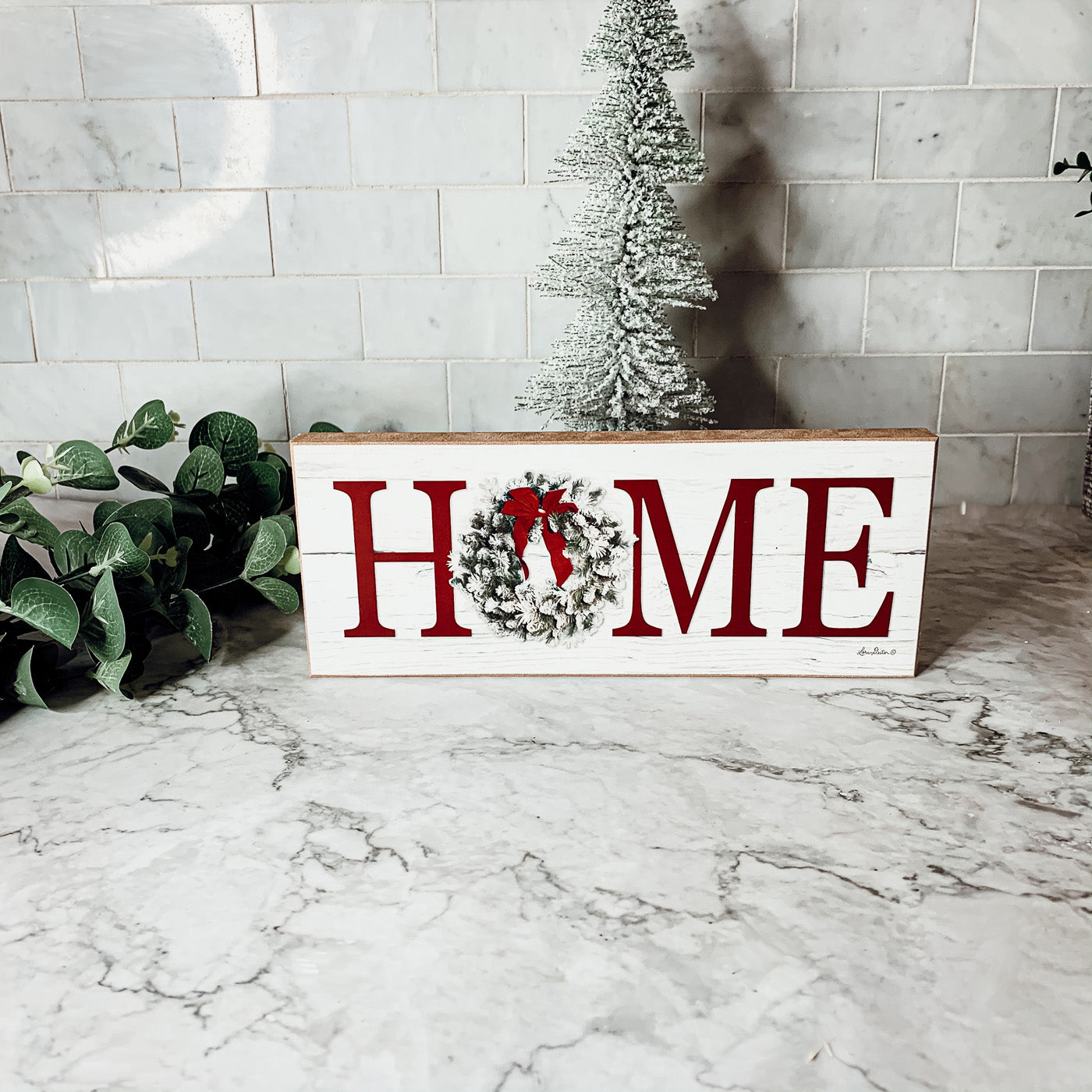 Handmade wooden Christmas Home sign with a festive wreath on the letter 'O', perfect for holiday decor.