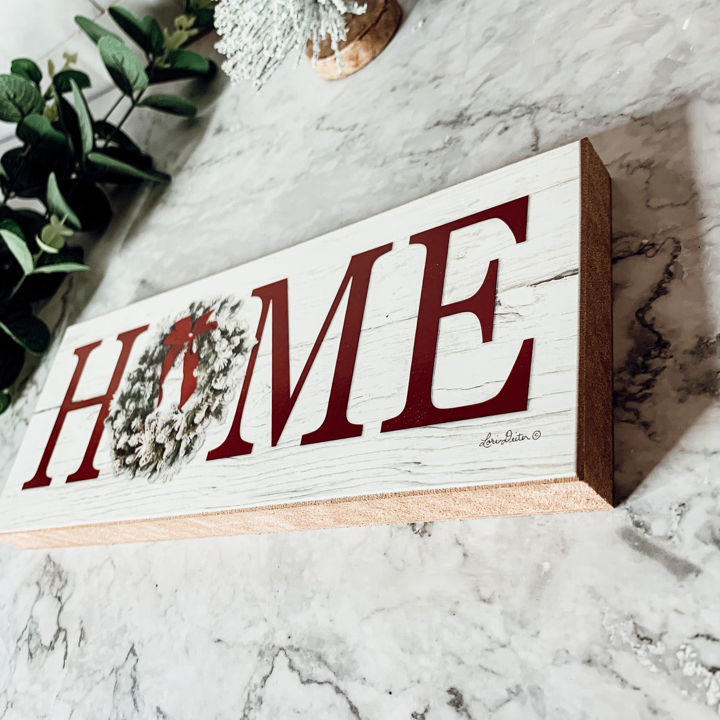 Handmade wooden Christmas Home sign with a festive wreath on the letter 'O', perfect for holiday decor.