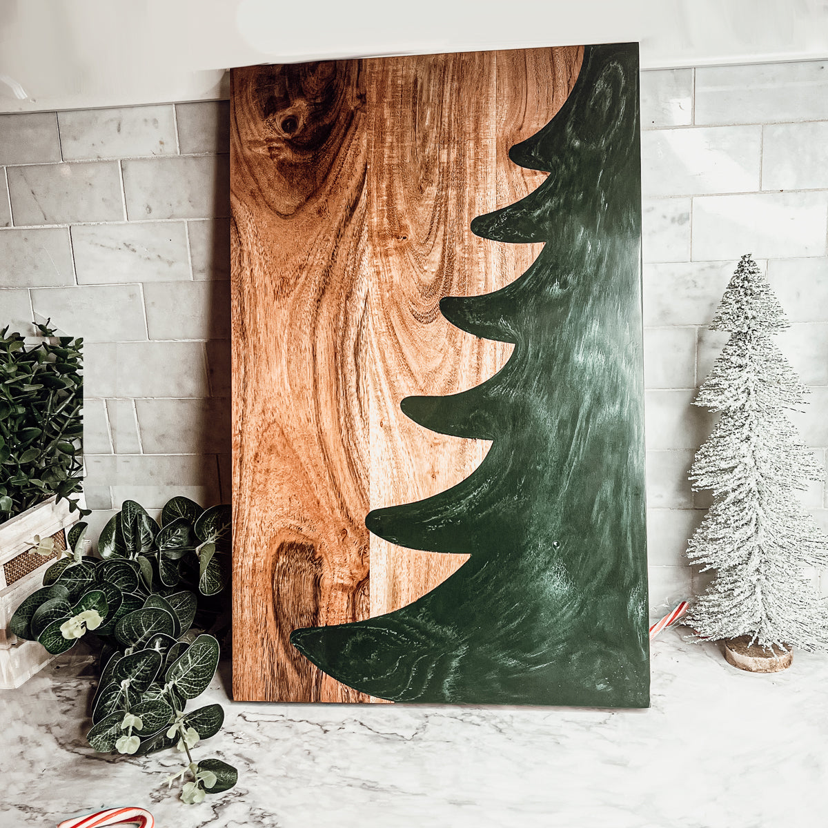 Hand-crafted Christmas Serving Board with marbled tree inlay, made from Acacia wood and resin, perfect for holiday gatherings.