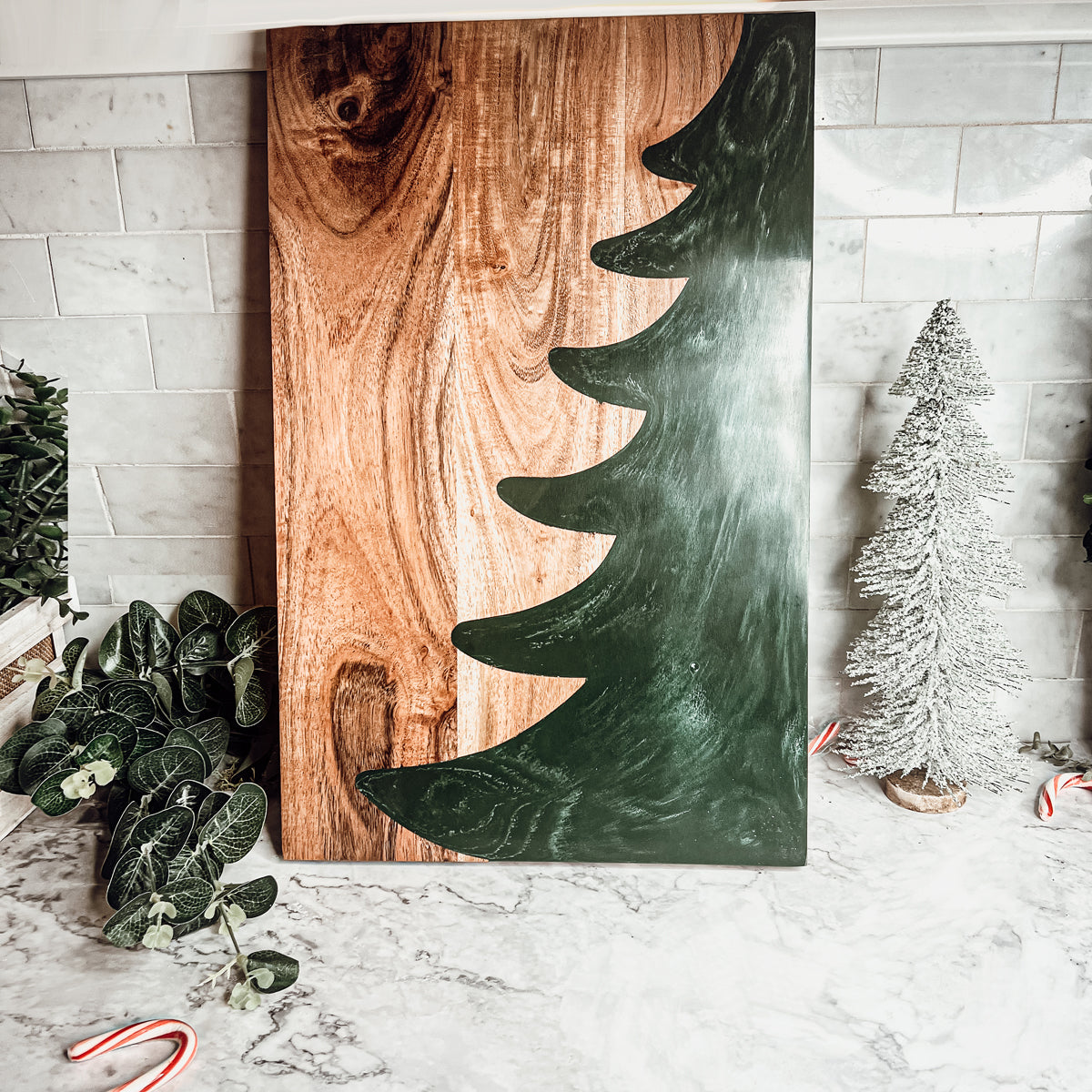 Hand-crafted Christmas Serving Board with marbled tree inlay, made from Acacia wood and resin, perfect for holiday gatherings.