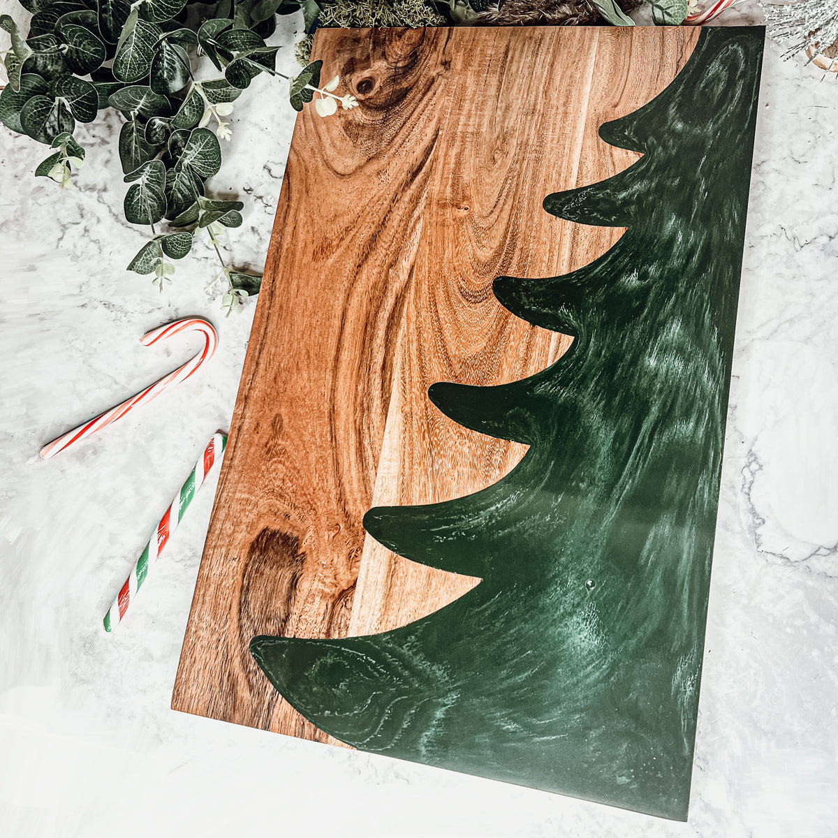 Hand-crafted Christmas Serving Board with marbled tree inlay, made from Acacia wood and resin, perfect for holiday gatherings.