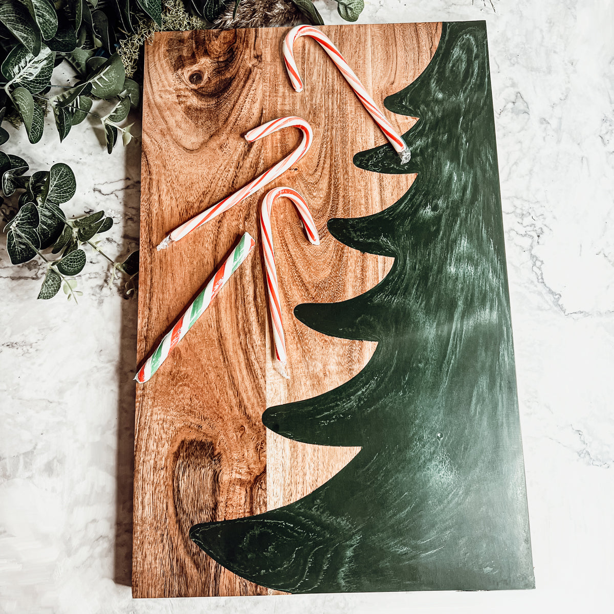 Hand-crafted Christmas Serving Board with marbled tree inlay, made from Acacia wood and resin, perfect for holiday gatherings.