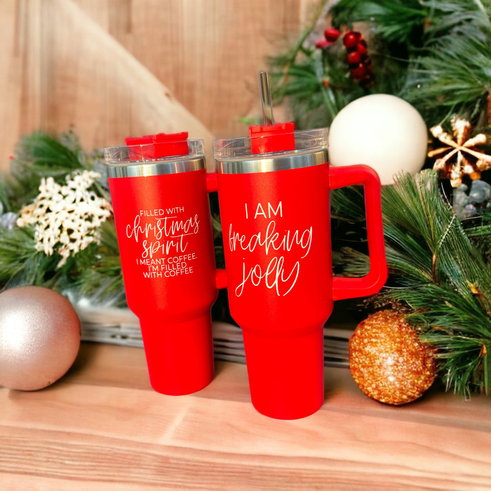 A vibrant red insulated mug with a humorous holiday quote, featuring a matte finish and a versatile 3-in-1 lid.