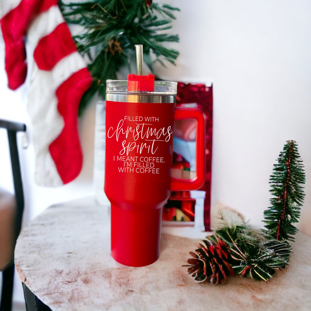 A vibrant red insulated mug with a humorous holiday quote, featuring a matte finish and a versatile 3-in-1 lid.