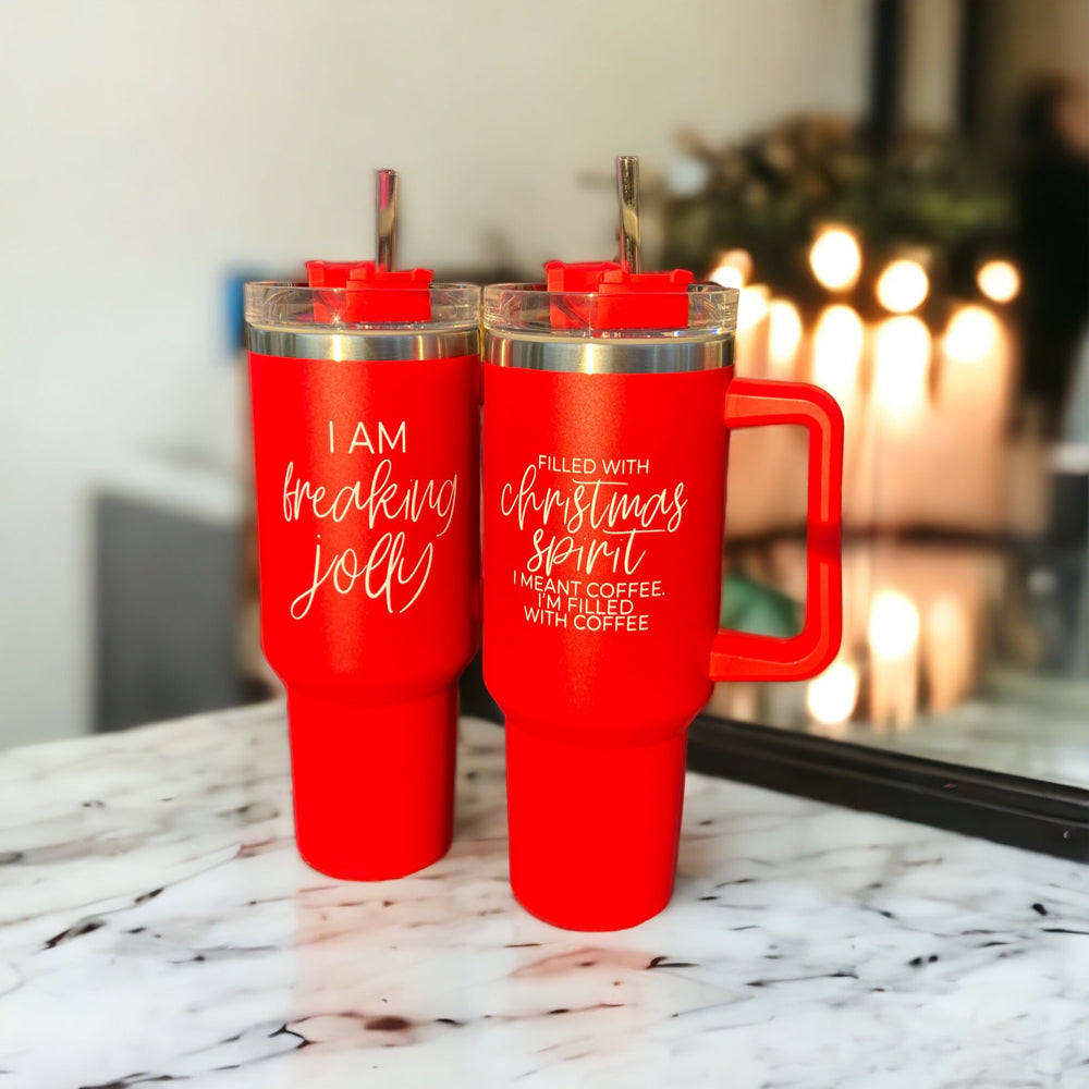 A vibrant red insulated mug with a humorous holiday quote, featuring a matte finish and a versatile 3-in-1 lid.