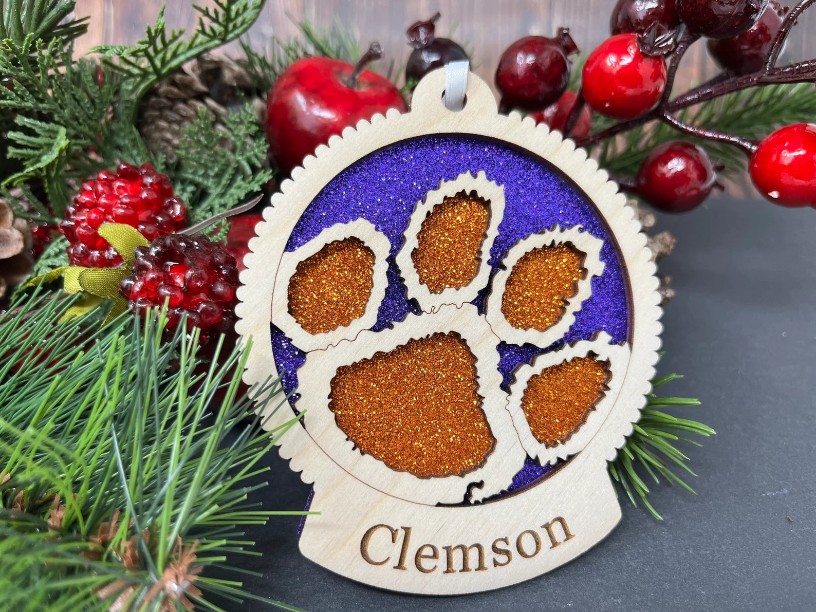 Handcrafted Clemson University ornament made of birch wood, featuring the Clemson logo, measuring 4x4 inches, packaged in a premium box.