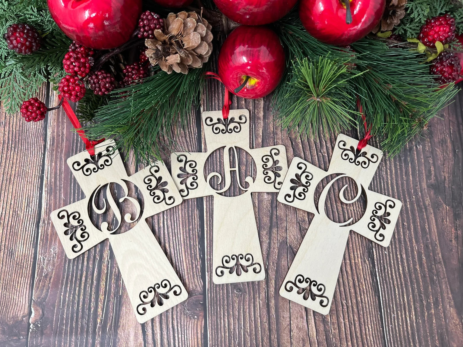 Handcrafted Cross Monogram Christmas ornament made from premium Baltic Birch wood, featuring customizable letters and a festive ribbon for hanging.