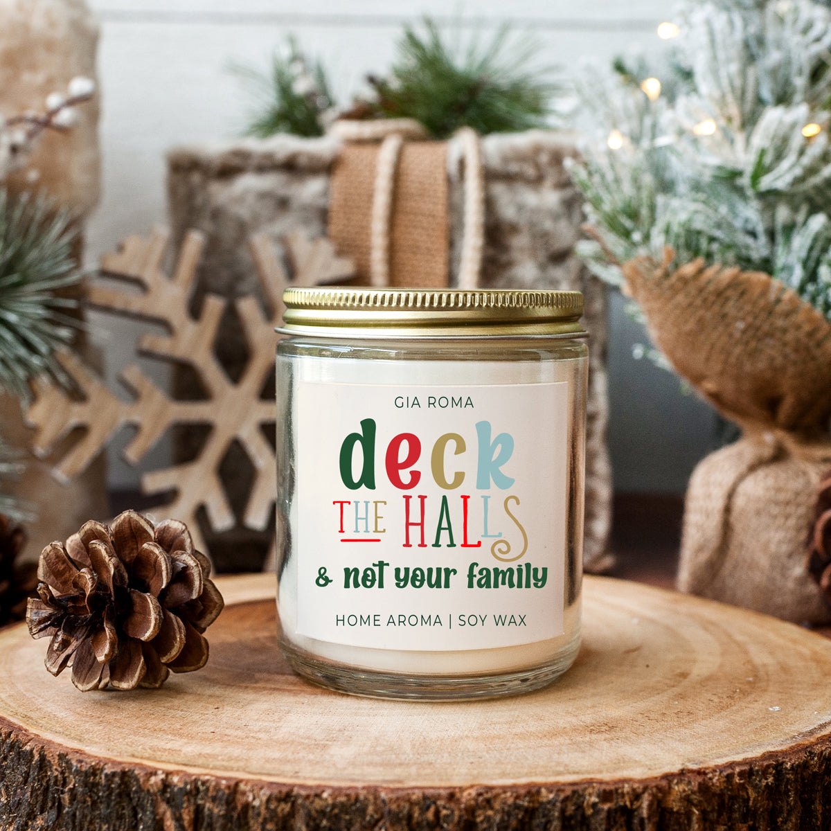 Deck The Halls Candle in a 9oz jar with festive scent notes of clove, cinnamon, berry, plum, and fir, perfect for holiday ambiance.