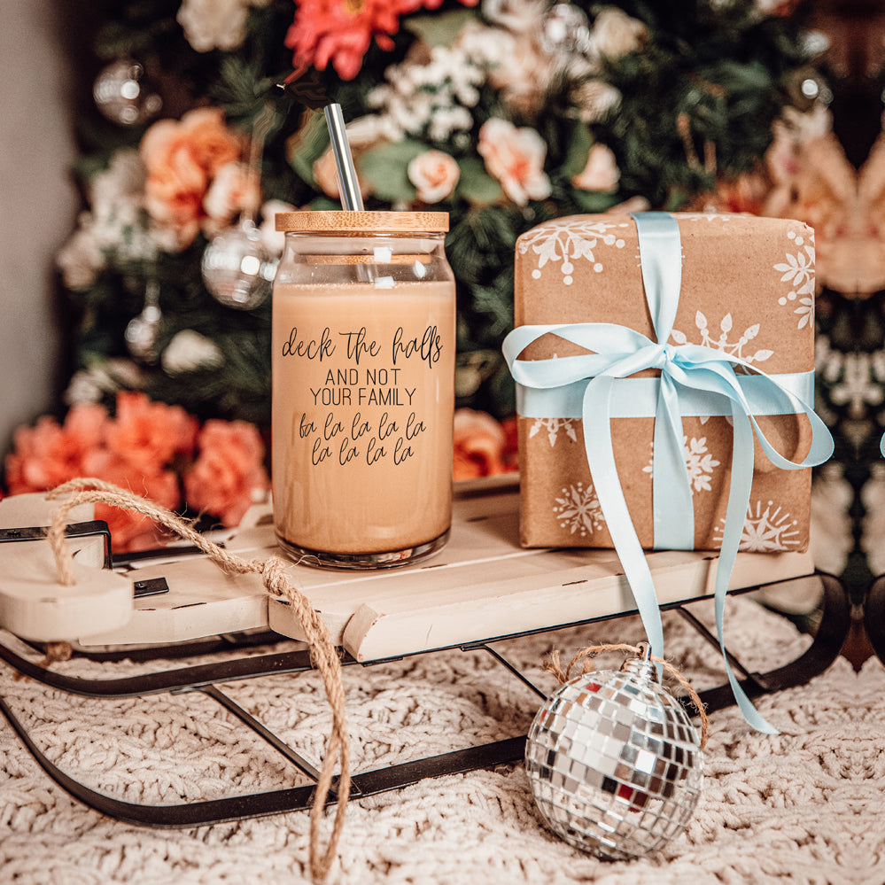 Deck the Halls Cup with bamboo lid and stainless steel straws, showcasing a modern design suitable for various beverages.