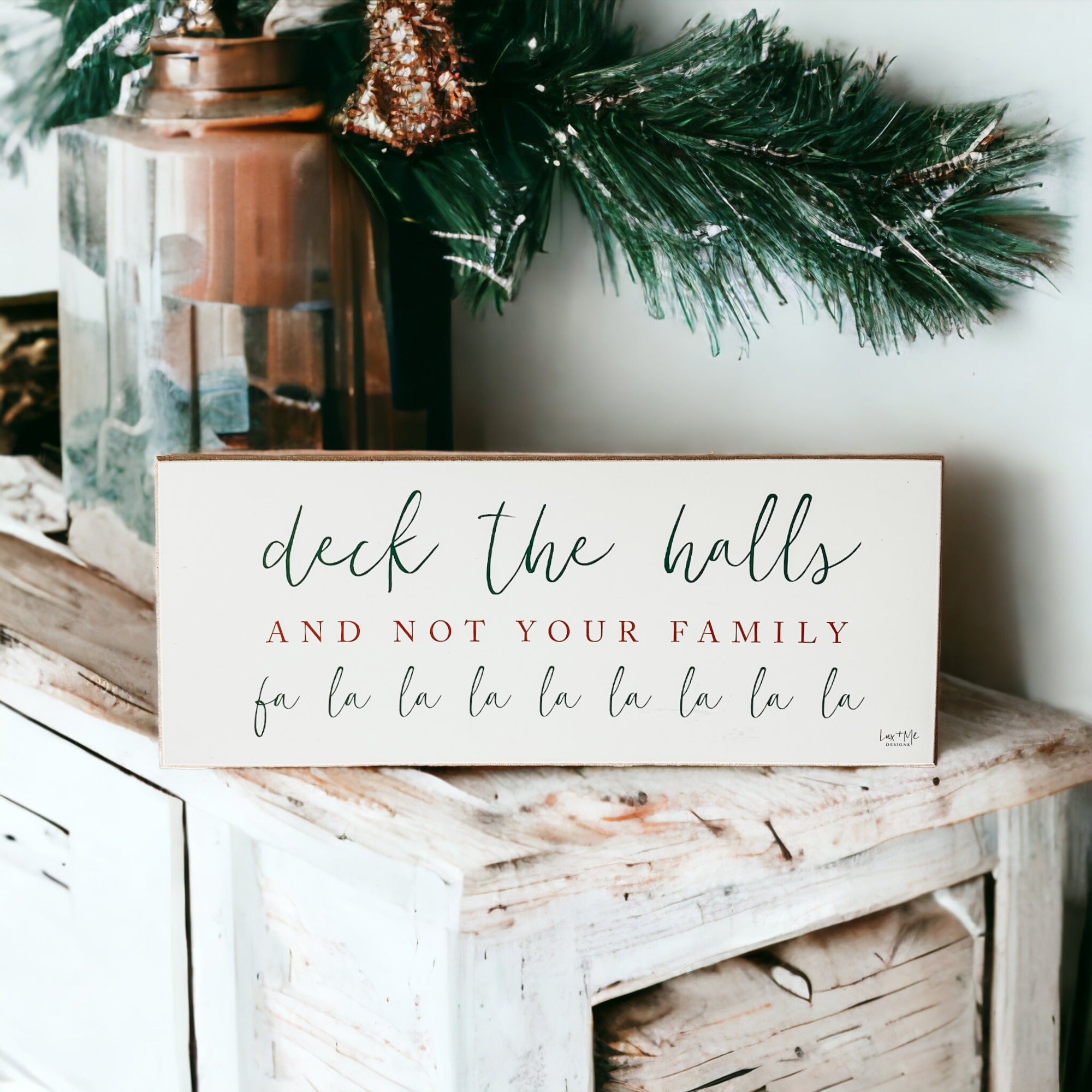 Handmade Deck The Halls Sign made of thick wood with a humorous Christmas quote in red and green, featuring a rustic textured area.