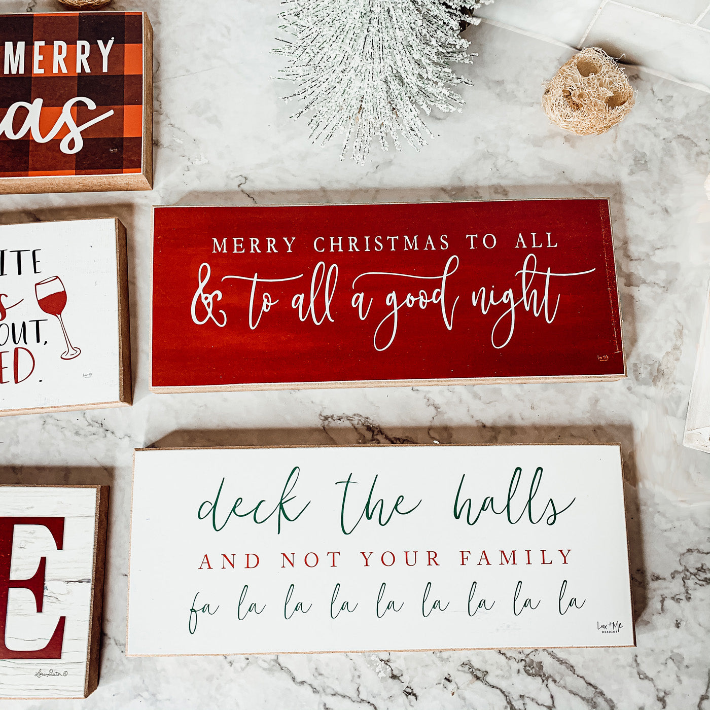 Handmade Deck The Halls Sign made of thick wood with a humorous Christmas quote in red and green, featuring a rustic textured area.