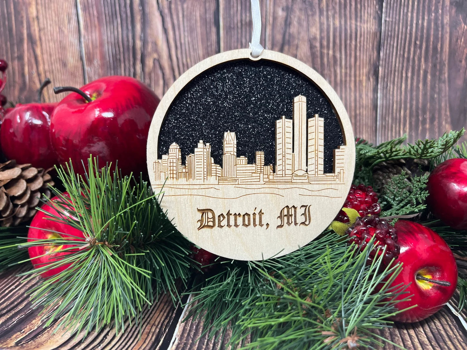 A beautifully crafted Detroit skyline ornament made from premium Baltic birch wood, showcasing intricate skyline details.