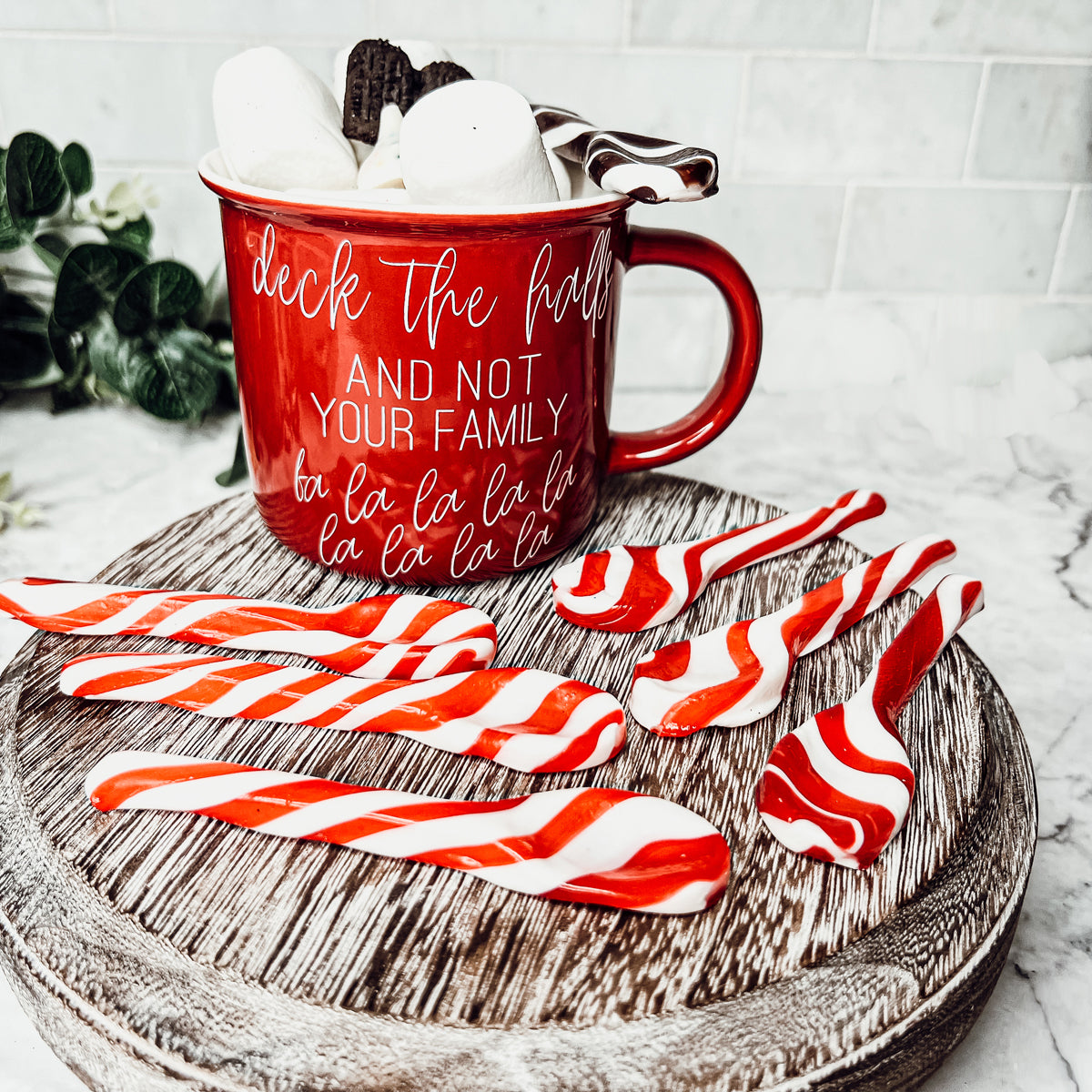 A colorful assortment of edible spoons in three flavors: Peppermint Twist, Cinnamon, and Hot Cocoa Twist, beautifully packaged in a gift box.