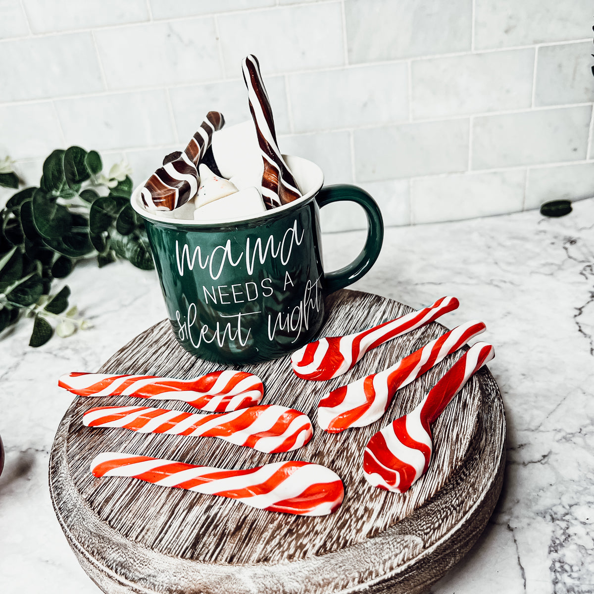 A colorful assortment of edible spoons in three flavors: Peppermint Twist, Cinnamon, and Hot Cocoa Twist, beautifully packaged in a gift box.