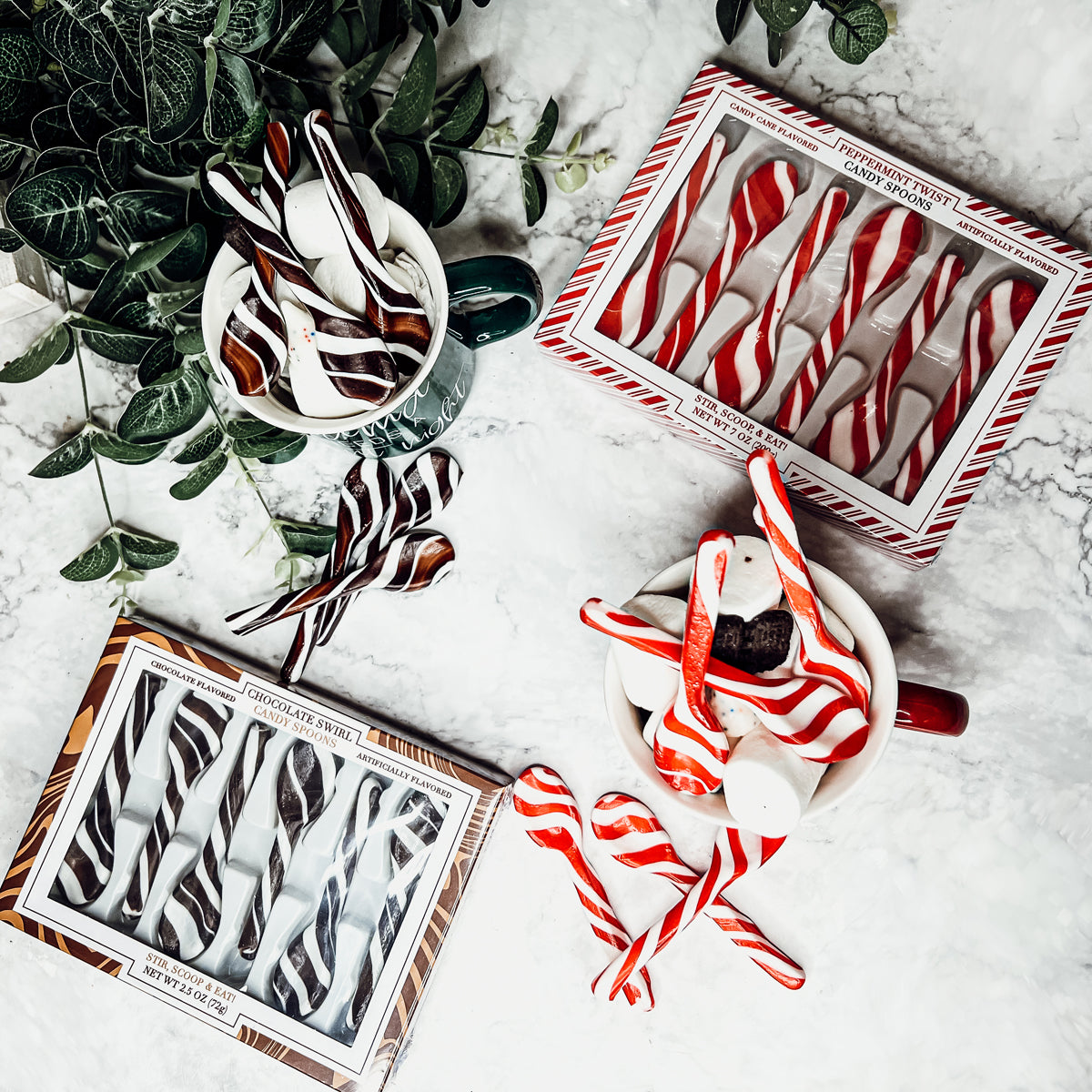 A colorful assortment of edible spoons in three flavors: Peppermint Twist, Cinnamon, and Hot Cocoa Twist, beautifully packaged in a gift box.