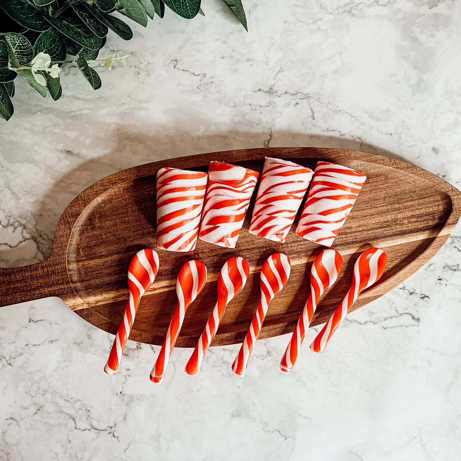 A colorful assortment of edible spoons in three flavors: Peppermint Twist, Cinnamon, and Hot Cocoa Twist, beautifully packaged in a gift box.