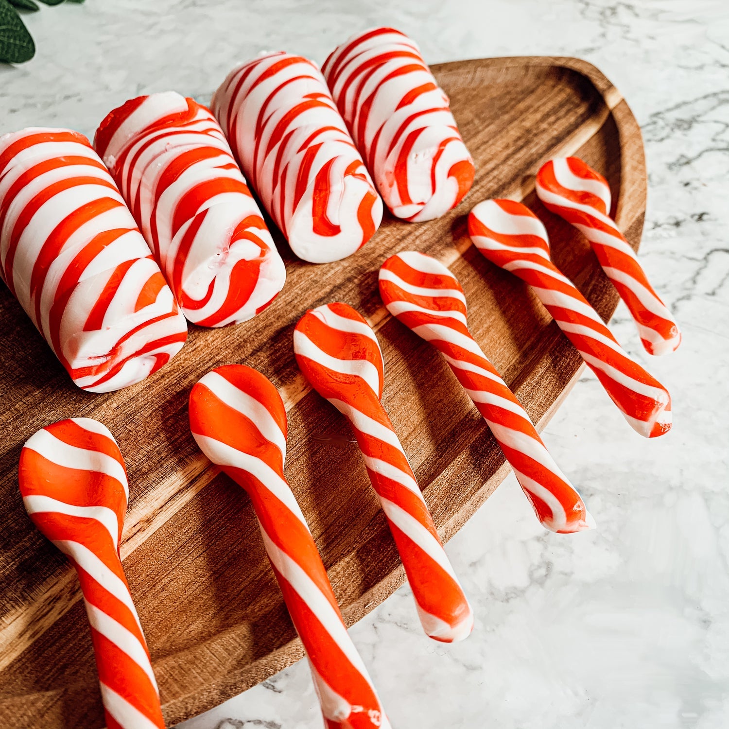 A colorful assortment of edible spoons in three flavors: Peppermint Twist, Cinnamon, and Hot Cocoa Twist, beautifully packaged in a gift box.