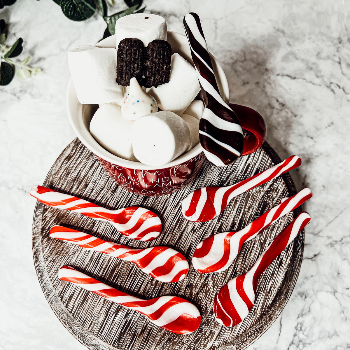 A colorful assortment of edible spoons in three flavors: Peppermint Twist, Cinnamon, and Hot Cocoa Twist, beautifully packaged in a gift box.