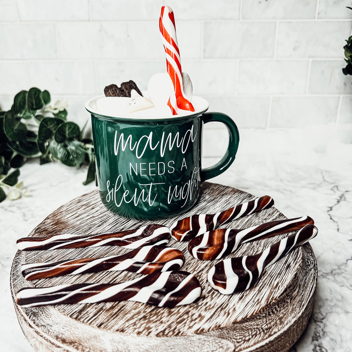 A colorful assortment of edible spoons in three flavors: Peppermint Twist, Cinnamon, and Hot Cocoa Twist, beautifully packaged in a gift box.